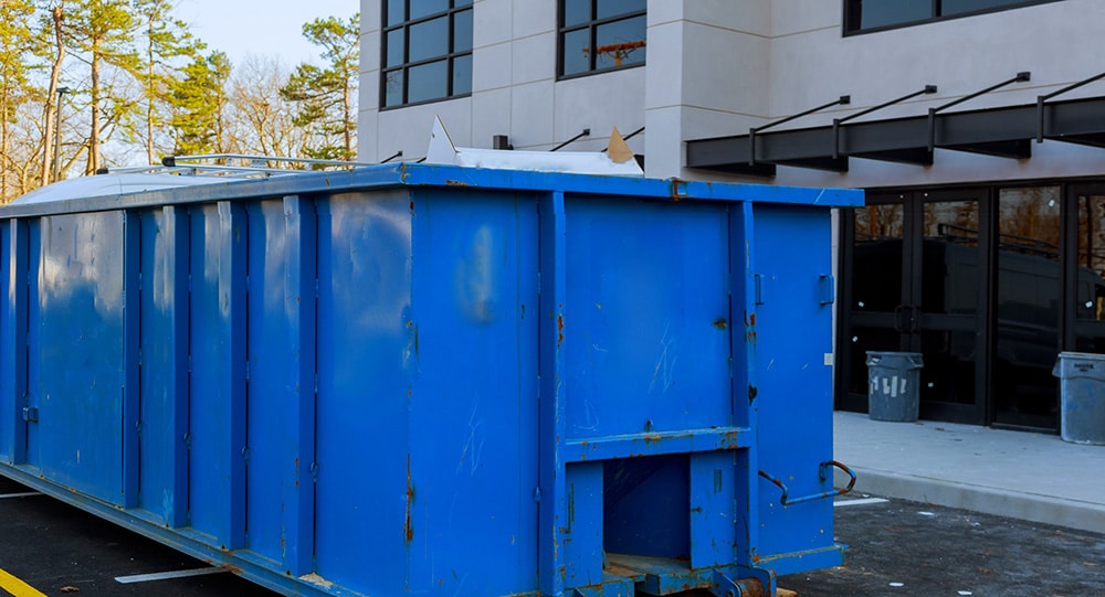Rental dumpster outside of a commercial property
